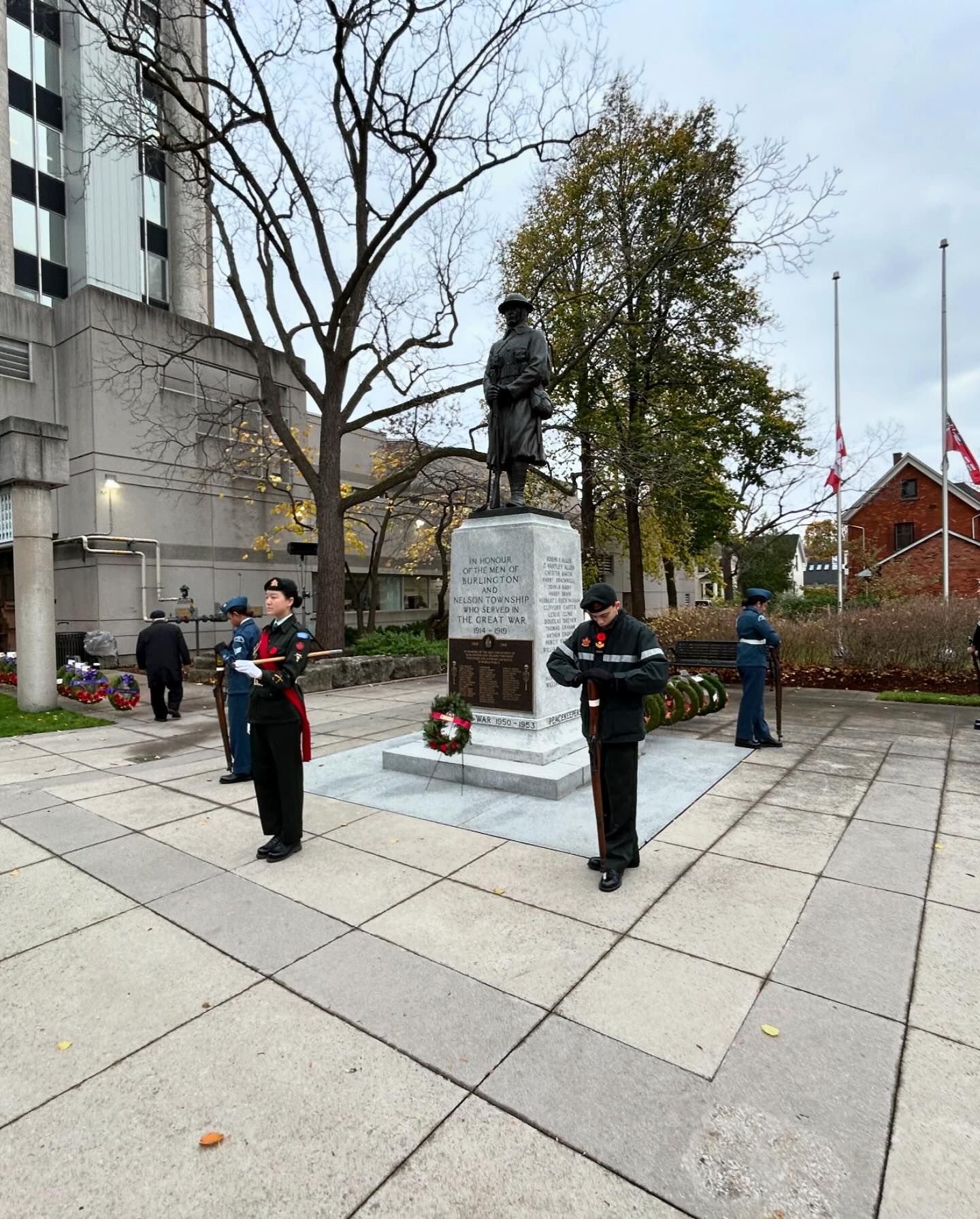 Cadets and memorial shown in a wide daytime event shot