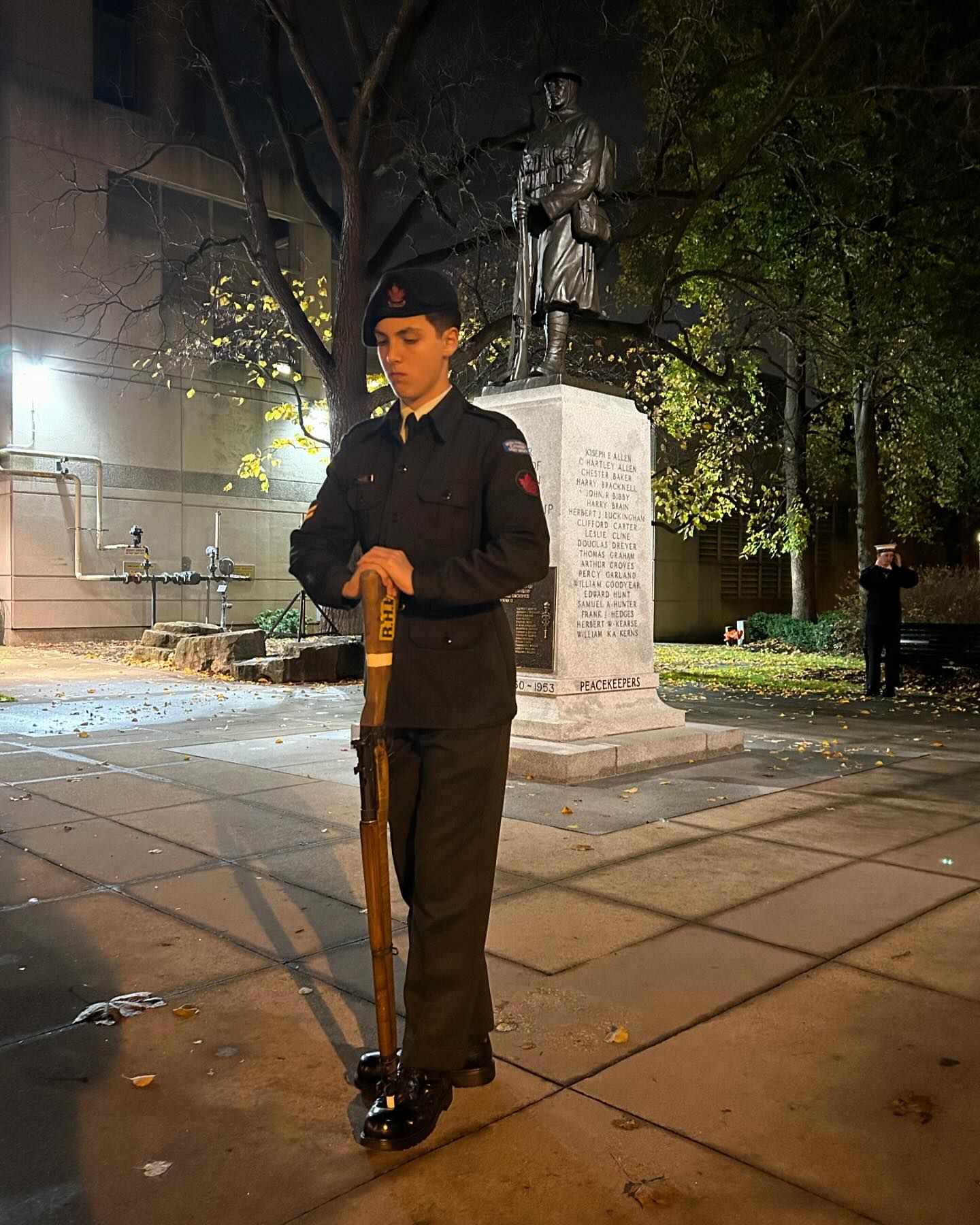 Cadets and attendees surrounding the memorial during the event