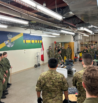Instructor leading a practical demonstration while cadets observe