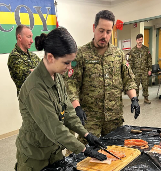 Indoor activity floor overview with cadets and instructors in session