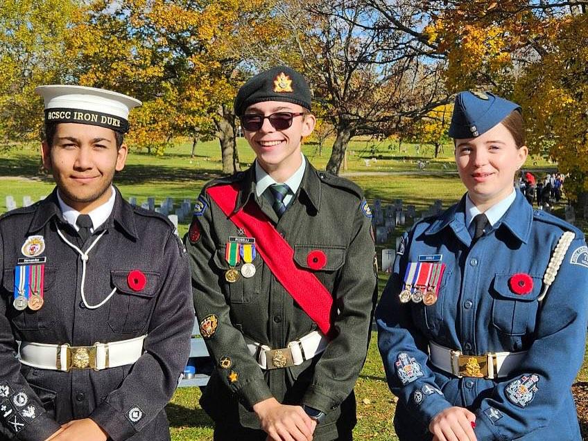 Cadets carrying wreaths during the remembrance ceremony on an autumn day