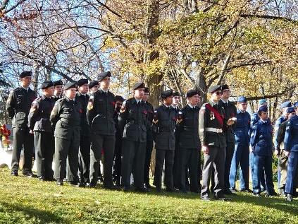 Tri-elemental cadets posing together in dress uniforms at the ceremony grounds